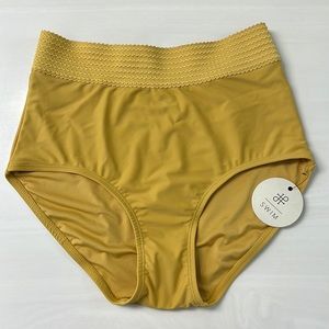 Adorable mustard yellow high waisted bikini bottoms with textured waistline.